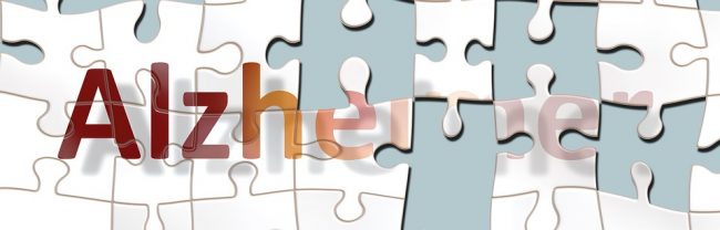Bild zeigt das Wort Alzheimer als ein Puzzle, von dem Teile fehlen